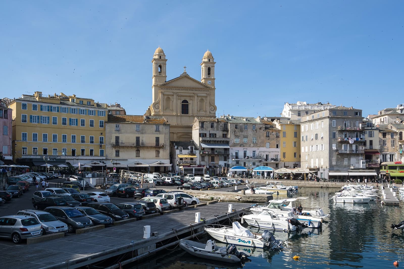 The twin-towered church of Saint-Jean-Baptiste above the boats and quays of Bastia’s Vieux Port
