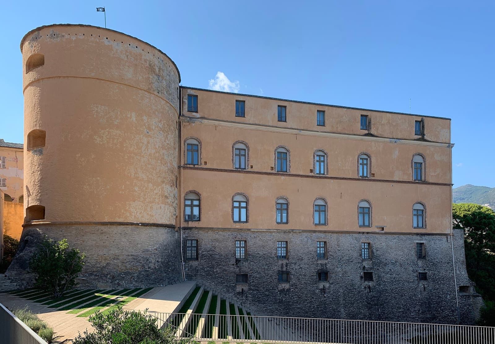 The round tower and ochre walls of the Governors’ Palace in the citadel of Bastia