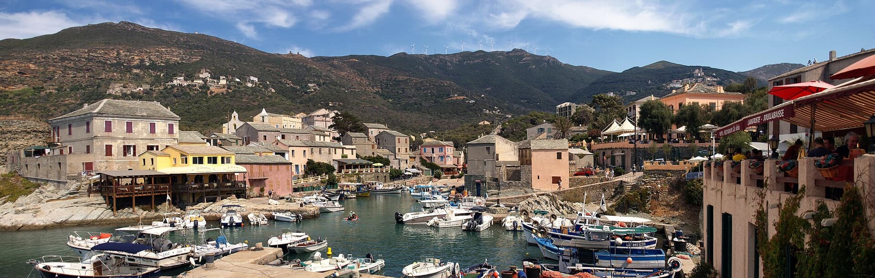 The fishing harbour of Centuri with its boats, restaurants and hillside houses
